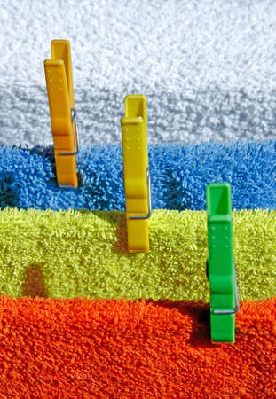Four cotton colorful towels drying in the sunの写真素材