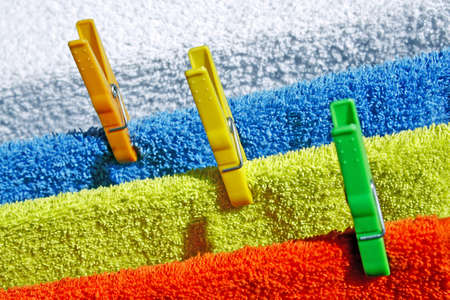 Four cotton colorful towels drying in the sunの写真素材