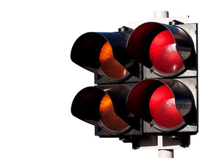 Double of traffic lights, orange and red, to sports car racing isolated on whiteの写真素材