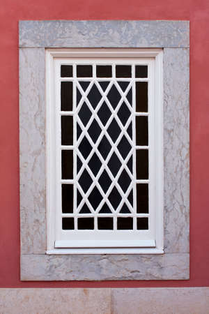Glazed window with mesh painted white woodの写真素材