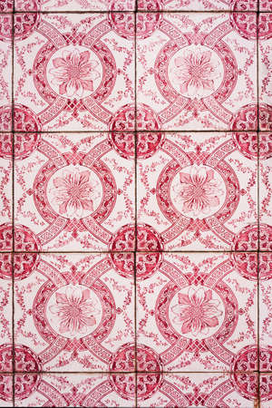 Wall mosaics with red floral motifs and white backgroundの写真素材