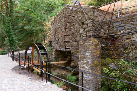 Iron and wood old Norias, in a beautiful watermill in a stone house, Portugal