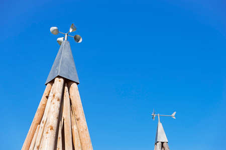 Cup anemometers supported by a pyramidal base of wooden trunksの写真素材