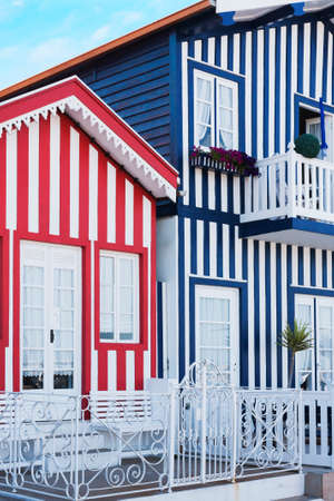 Wooden houses colored stripes, traditional of the fishermen of the Costa Nova, in Aveiro, Portugalの写真素材