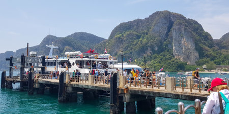 Tourists disembarking from boat at Phi Phi islandの写真素材