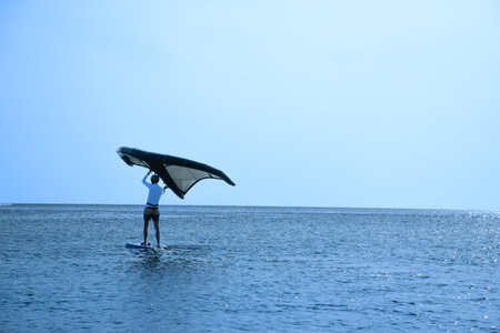 Man practicing kitesurf at the beachの写真素材