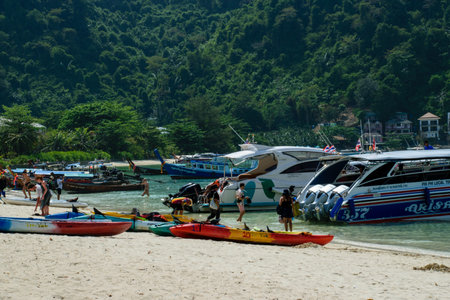 People travelling on boats at Thailandの写真素材