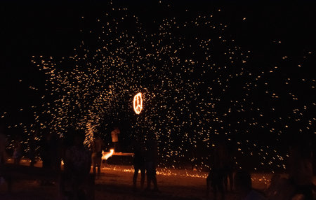 People having fun on fire party at Phi Phi Islandの写真素材
