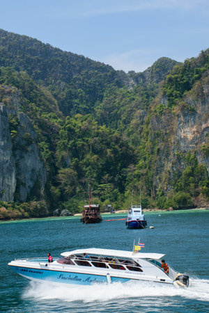 Black woman traveling in boat at Phi Phi Islandの写真素材