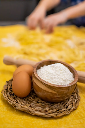 Close up of Pasta and Hands making home made Italian Pastaの写真素材