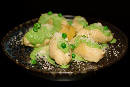 Gnocchi with potato and ricotta served with pestoの写真素材