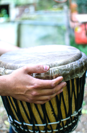 Drummer hands playing the ethnic djembe drum.の写真素材