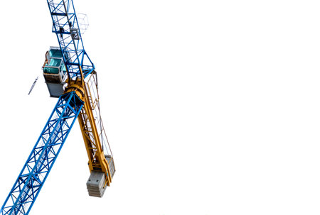 Construction Crane in blue and yellow color isolated in white backgroundの写真素材
