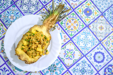 Typical Thai recipe Pineapple rice served in it is own pineappleの写真素材