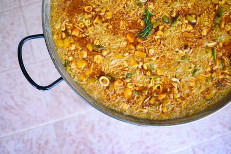 Traditional Fideua from Spain, a typical pasta made with paella ingredientsの写真素材
