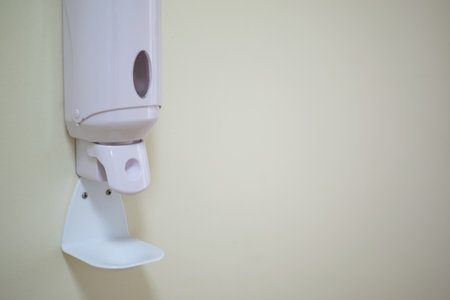 Image of disinfectant gel dispenser on hospital wall as antiviral and bacterial