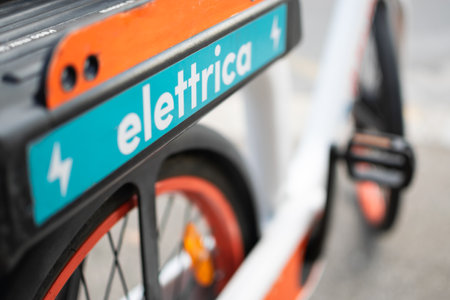 Close up view of Electric bike for rent parked on street for Eco use by phone appの写真素材