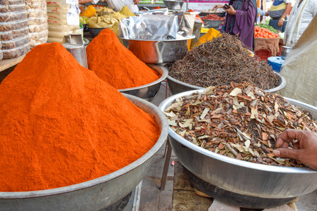 Different spices displayed in metal bowls in street market at Jodhpurの写真素材