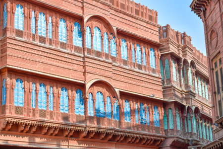 Dulmera Havelis in Bikaner with windows in green tones and touristy red facadesの写真素材