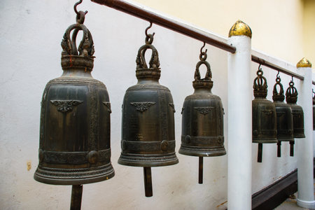 Traditional Bronze Bells At Buddhist Temple in Chiang Raiの写真素材