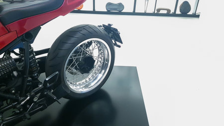 Side view of rear wheel of exposed luxury motorcycleの写真素材