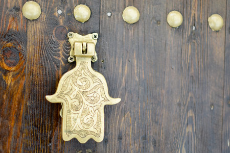 Fatima hand golden door knob at Marrakech medina and soukの写真素材
