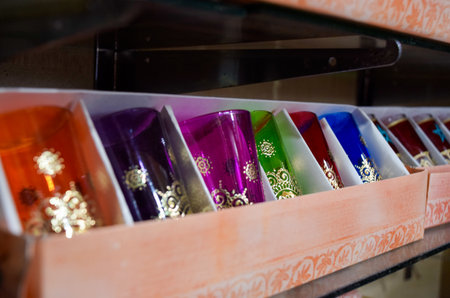Colorful tea glasses displayed in a souvenir shop in Marrakech.の写真素材