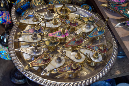 Small decorative oil lamps displayed in a souvenir shop in Marrakech.の写真素材
