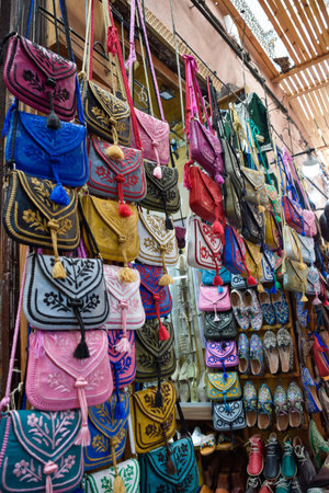 Different bags sewn in an artisanal way displayed in souvenir shop in Marrakech.の写真素材