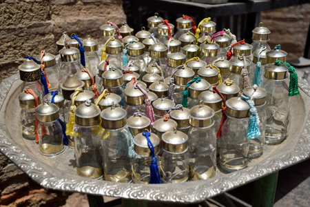 Colorful tea glasses displayed in a souvenir shop in Marrakech.の写真素材