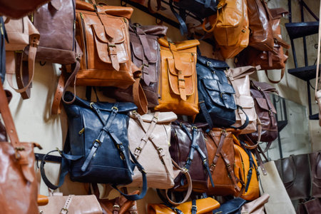 Different leather bags sewn artisanally displayed in souvenir shop in Marrakech.の写真素材