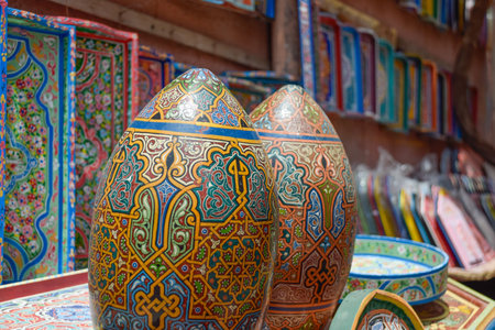 Close up view of colorful wooden eggs with hand painted Arabic geometric figuresの写真素材
