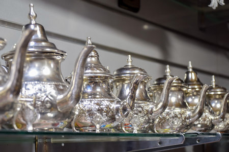 Bright Arabic style teapots displayed online at a business in Marrakechの写真素材