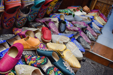 Slippers or sandals of many colors hung from street stalls in Marrakechs soukの写真素材