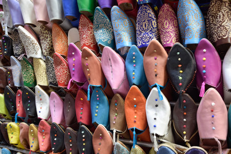 Slippers or sandals of many colors hung from street stalls in Marrakechs soukの写真素材