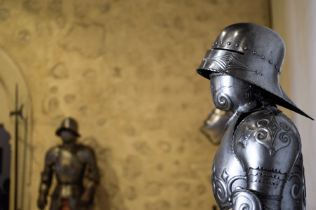 Side view of Medieval Armor with details and other armor with pike in backgroundの写真素材
