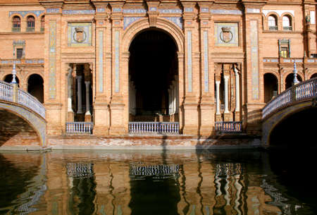 Building reflex in the  famous Plaza de Espana, Sevilla, Spain  Old city landmark  のeditorial素材