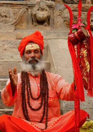 KATHMANDU, NEPAL - SEPTEMBER 26, 2009  An Hindu holy pilgrim sits in durbar square, in ancient Kathmandu Valleyのeditorial素材