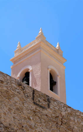 ancient fortified wall and the tower bell of parish church の写真素材