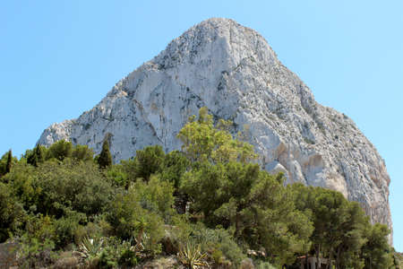 Natural Park of Penon de Ifach situated in Calp, Spain  A massive limestone outcrop emerging from the sea and linked to the shore by rock debris  Is home to numerous rare plants and over 300 species of animals, and nesting site for sea birds and other birの写真素材