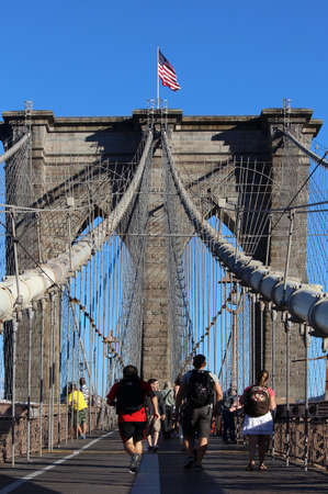 NEW YORK, SEPTEMBER 05: Pedestrians and tourists in Famous historic Brooklyn Bridge in Manhattan...