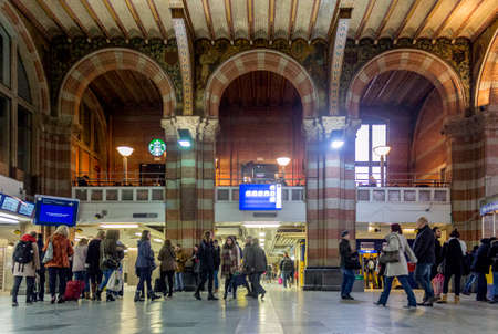 AMSTERDAM - FEBRUARY 07, 2015: Central Station on February 07, 2015 in Amsterdam. Central Station is the central railway station of Amsterdam and is used by 250,000 passengers a day.のeditorial素材