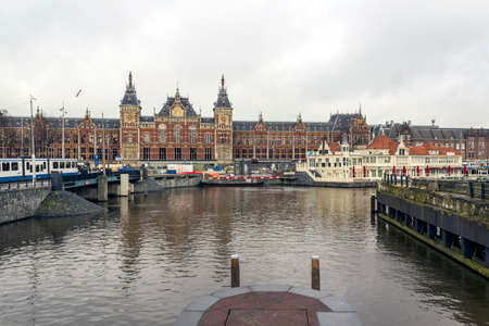 AMSTERDAM - FEBRUARY 07, 2015: Central Station on February 07, 2015 in Amsterdam. Central Station is the central railway station of Amsterdam and is used by 250,000 passengers a day.のeditorial素材