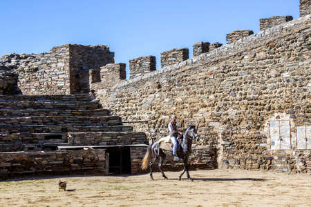MONSARAZ - APRIL 06: Horse training in Alentejo Town of Monsaraz castle inner space (used as a traditional bullfighting arena), on April 06, 2014, in Monsaraz, Portugal.のeditorial素材