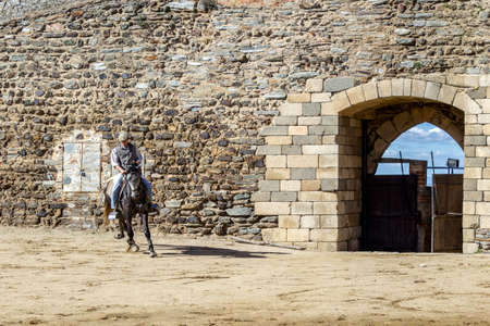MONSARAZ - APRIL 06: Horse training in Alentejo Town of Monsaraz castle inner space (used as a traditional bullfighting arena), on April 06, 2014, in Monsaraz, Portugal.のeditorial素材