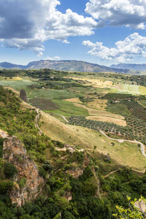 Ronda view. A city in the Spanish province of Malaga, within the autonomous community of Andalusia. Is situated in a very mountainous area about 750 m above mean sea level. The Guadalevin River runs through the city, dividing it in two and carving out theの写真素材