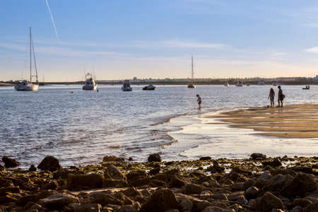 People enjoying spring sunset time in QuatroAguas East beach Ria Formosa Natural Reserve at Tavira. Algarve Portugal.のeditorial素材