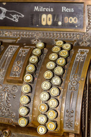 Keyboard closeup of an Antique cash register. Image useful as communication, economy and other concepts.のeditorial素材
