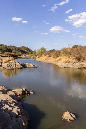 Countryside landscape scenic view of a fresh water stream on a natural park trail, in the Alentejo tourism destination region, Portugal.の写真素材