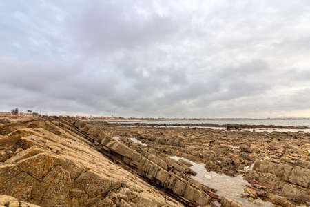 Sunset Atlantic Ocean view at Dar Bouazza rocky beach, in Casablanca south coast. Morocco.の写真素材